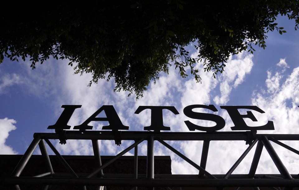 A sign in front of an office building for The International Alliance of Theatrical Stage Employees is pictured, Monday, Oct. 4, 2021, in Burbank, Calif. The IATSE overwhelmingly voted to authorize a strike for the first time in its 128-year history.(AP Photo/Chris Pizzello)