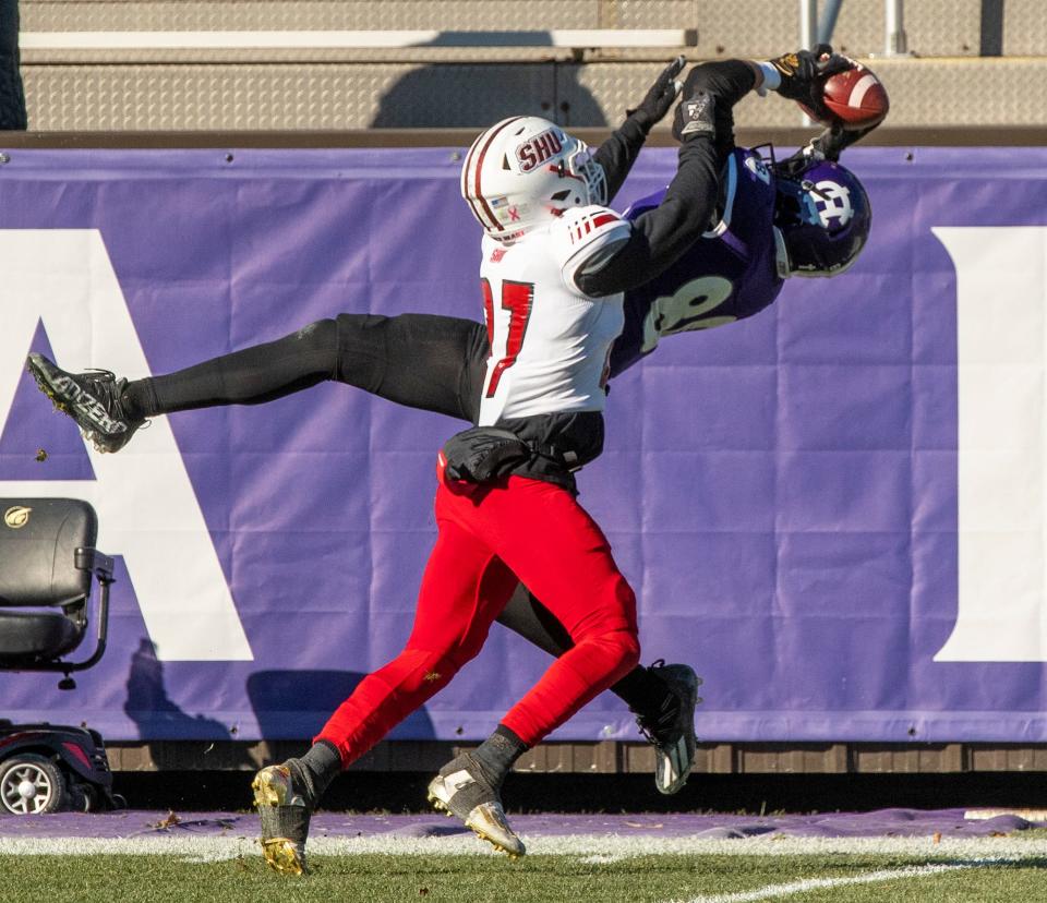 Holy Cross wide receiver Jalen Coker catches a pass for a first down in the first quarter against Sacred Heart University at Fitton Field.