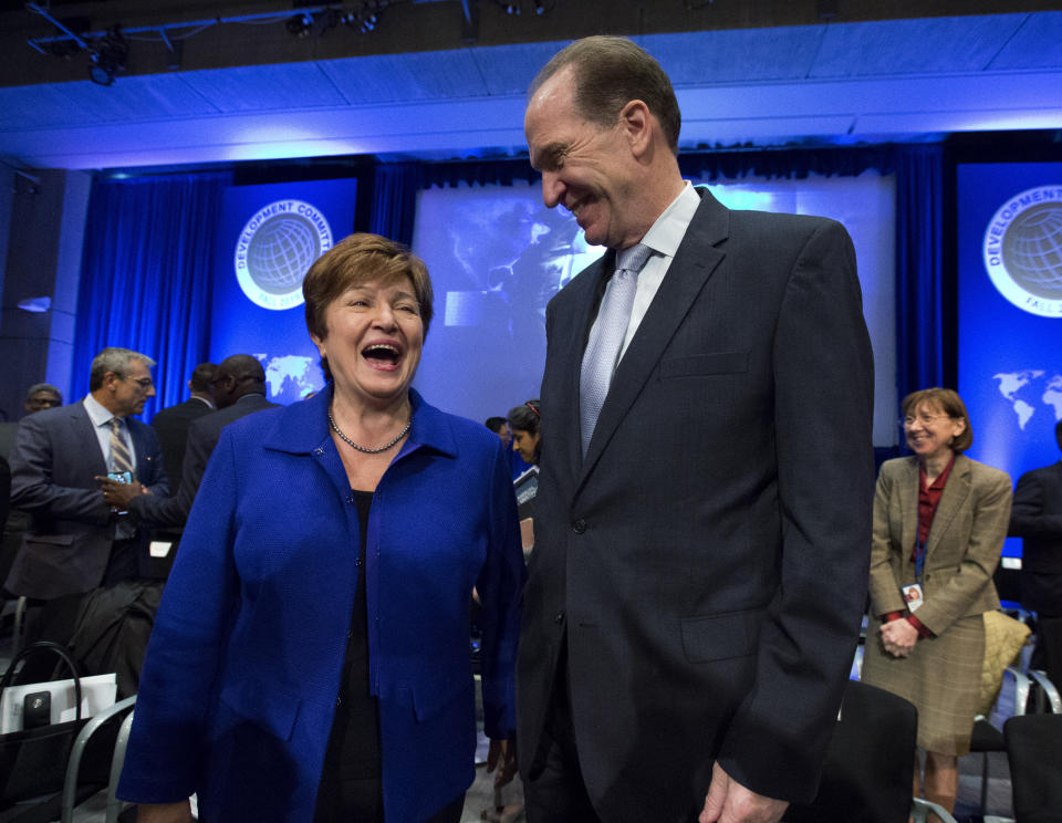 International Monetary Fund Managing Director Kristalina Georgieva speaks with World Bank President David Malpass during the Development Committee plenary at the World Bank/IMF Annual Meetings in Washington, Saturday, Oct. 19, 2019. (AP Photo/Jose Luis Magana)