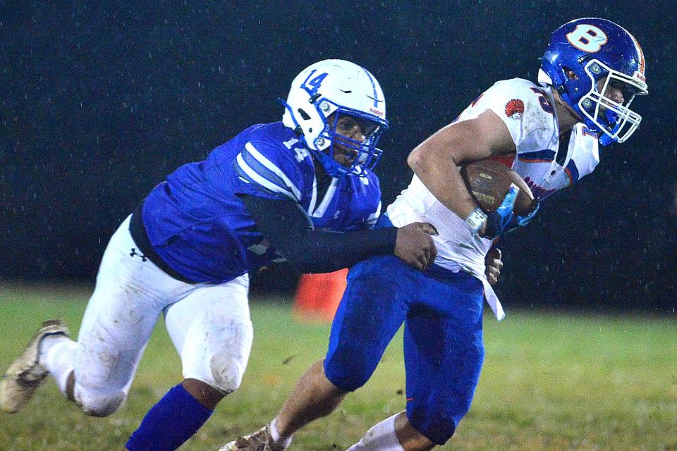 Williamsport's Corry Nelson tackles Boonsboro's Luke Churchey during the first half of Friday night's game.