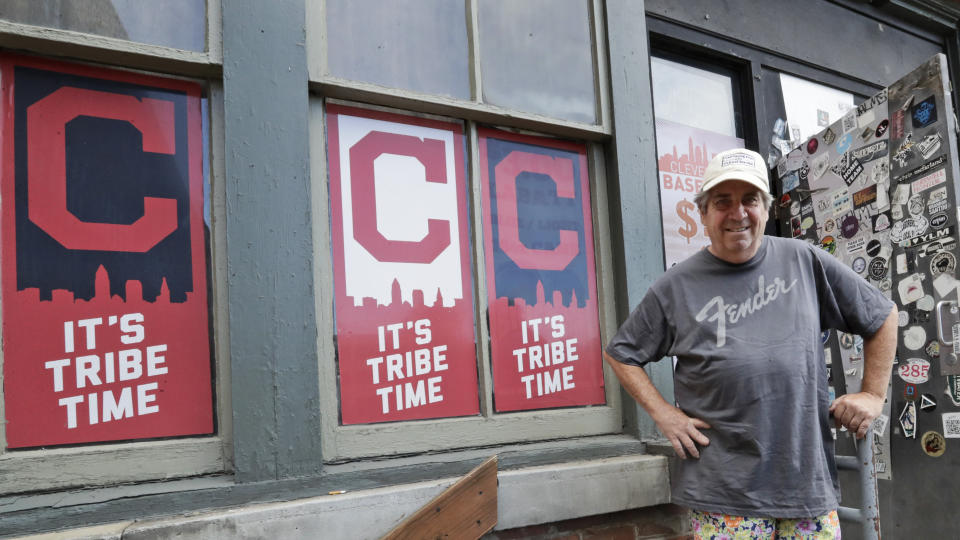 Mike Miller, owner of Wilbert's Food & Music, poses in front of the restaurant before a baseball game between the Minnesota Twins and the Cleveland Indians, Tuesday, Aug. 25, 2020, in Cleveland. The coronavirus pandemic has been especially hard on businesses that rely on ballpark traffic, eliminating crowds at major league games, and leading to rules that limit the amount of people they can have inside their doors at the same time. (AP Photo/Tony Dejak)