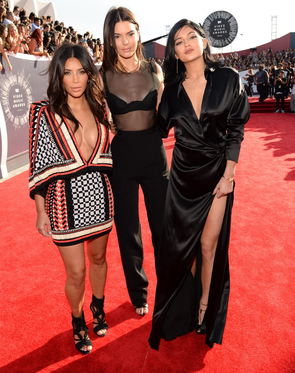 INGLEWOOD, CA - AUGUST 24:  Kim Kardashian, Kendall Jenner and Kylie Jenner attend the 2014 MTV Video Music Awards at The Forum on August 24, 2014 in Inglewood, California.  (Photo by Kevin Mazur/WireImage)
