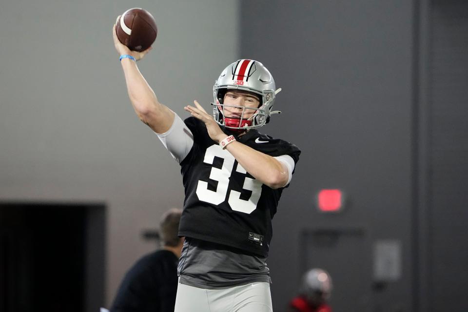 Mar 9, 2023; Columbus, Ohio, USA;  Ohio State Buckeyes quarterback Devin Brown (33) throws during spring football practice at the Woody Hayes Athletic Center. Mandatory Credit: Adam Cairns-The Columbus Dispatch