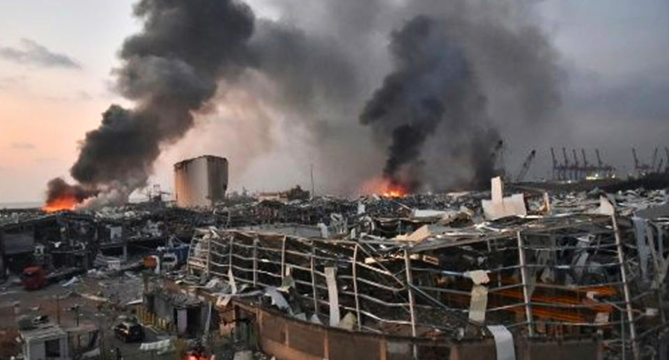 Smoke billowed into the air as a buildings nearby barely stood. source: AFP