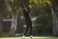 Dustin Johnson hits his second shot on the third hole during the Genesis Invitational pro-am golf event at Riviera Country Club, Wednesday, Feb. 17, 2021, in the Pacific Palisades area of Los Angeles. (AP Photo/Ryan Kang)