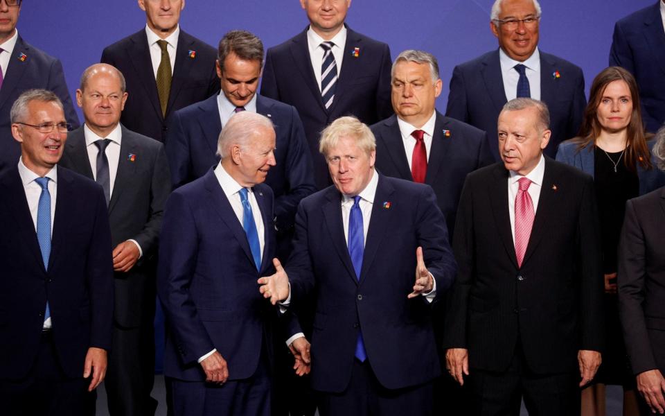 Boris Johnson and other Nato leaders pose for a family photograph in Madrid, Spain today - Susana Vera/Reuters