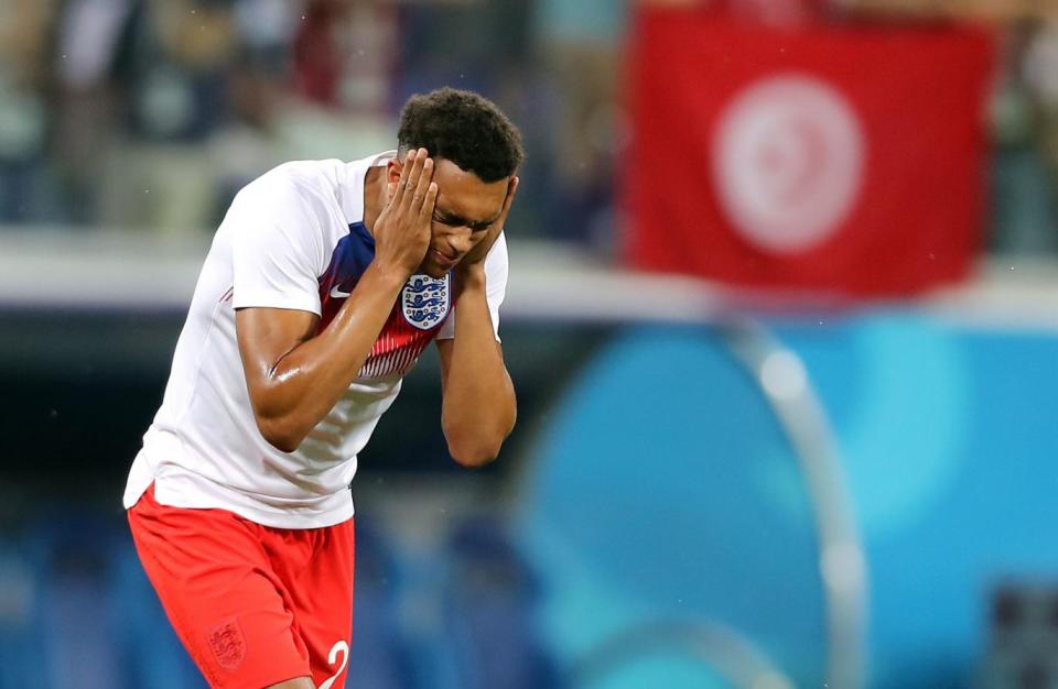 England's Trent Alexander-Arnold rubs insect repellent on his face (PA)