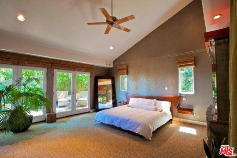 4) A master suite with high ceilings, private balcony, and luxe en-suite