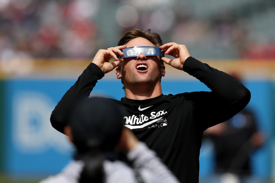 Tanner Banks of the Chicago White Sox watches the solar eclipse. / Credit: Lauren Leigh Bacho/MLB Photos via Getty Images