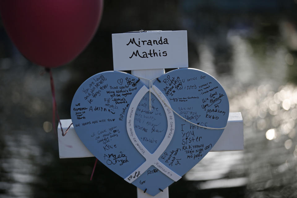 CORRECTS SPELLING TO MARANDA FROM MIRANDA - Maranda Mathis' cross stands at a memorial site for the victims killed in this week's shooting at Robb Elementary School in Uvalde, Texas, Friday, May 27, 2022. (AP Photo/Dario Lopez-Mills)
