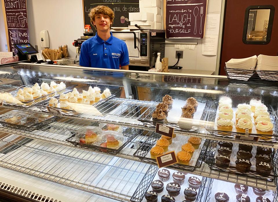 B-P junior David Faria mans the counter at the café with an array of student prepared pastries in the case on Oct. 6, 2022.