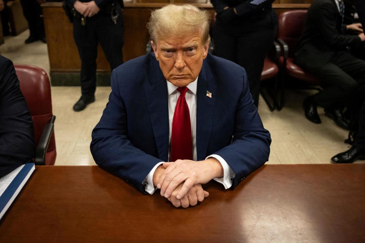 <span>Donald Trump attends his trial for allegedly covering up hush-money payments at Manhattan criminal court in New York City.</span><span>Photograph: Yuki Iwamura/AFP/Getty Images</span>