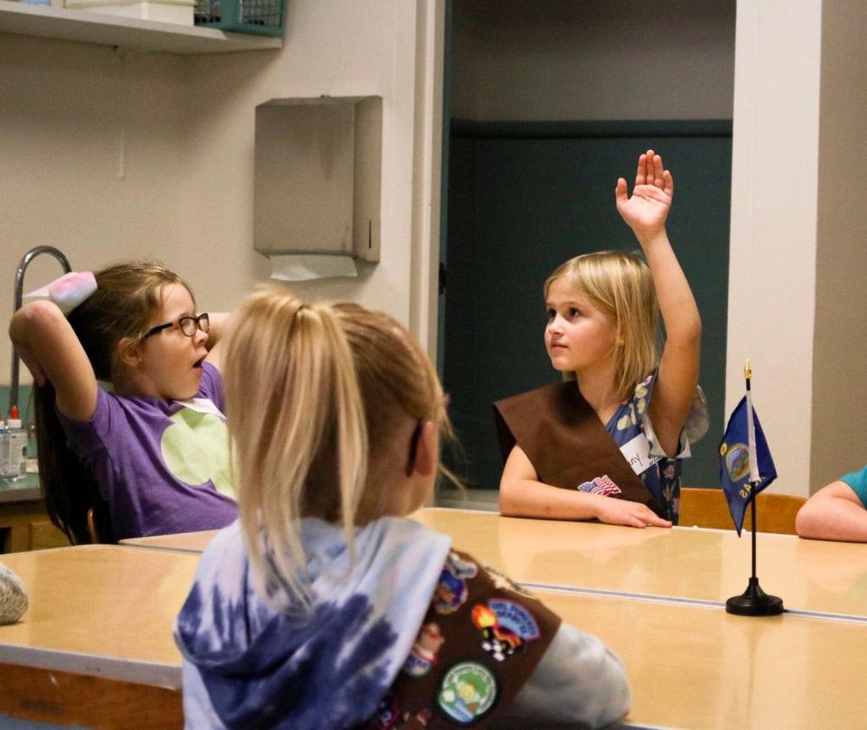 Bethany Wilde, 7, (right) of Derby, Kansas answers a question at the Salina League of Women Voters workshop Jan. 14.