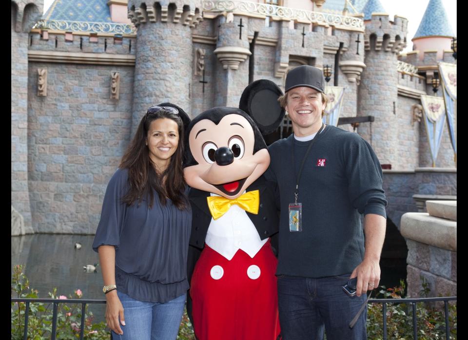 Matt Damon and his wife Luciana pose with Mickey Mouse at Sleeping Beauty Castle at Disneyland April 22, 2011 in Anaheim, California.      (Photo by Paul Hiffmeyer/Disney Parks via Getty Images)