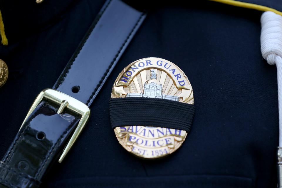 A black band covers the badge of a member of the Savannah Police Department Honor Guard during the annual Police Memorial Ceremony on Tuesday, May 16, 2023.