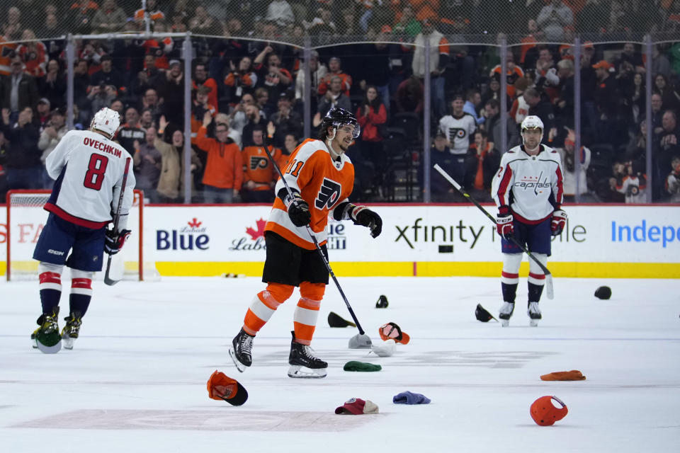 Philadelphia Flyers' Travis Konecny (11) reacts after scoring his third goal during an NHL hockey game against the Washington Capitals, Wednesday, Jan. 11, 2023, in Philadelphia. (AP Photo/Matt Slocum)