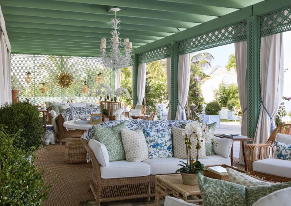 a living room with a couch and chairs