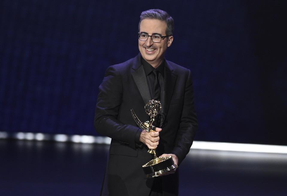 FILE - John Oliver accepts the award for outstanding writing for a variety series for "Last Week Tonight With John Oliver" at the 71st Primetime Emmy Awards on Sept. 22, 2019 in Los Angeles. Before hosting his own show, Oliver was a cast member on "The Daily Show with John Stewart." (Photo by Chris Pizzello/Invision/AP, File)