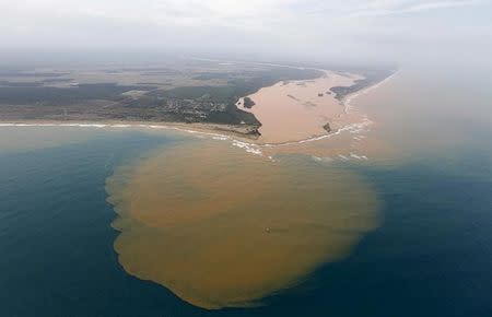 An aerial view of the Rio Doce (Doce River), which was flooded with mud after a dam owned by Vale SA and BHP Billiton Ltd burst, at an area where the river joins the sea on the coast of Espirito Santo in Regencia Village, Brazil, November 23, 2015. REUTERS/Ricardo Moraes