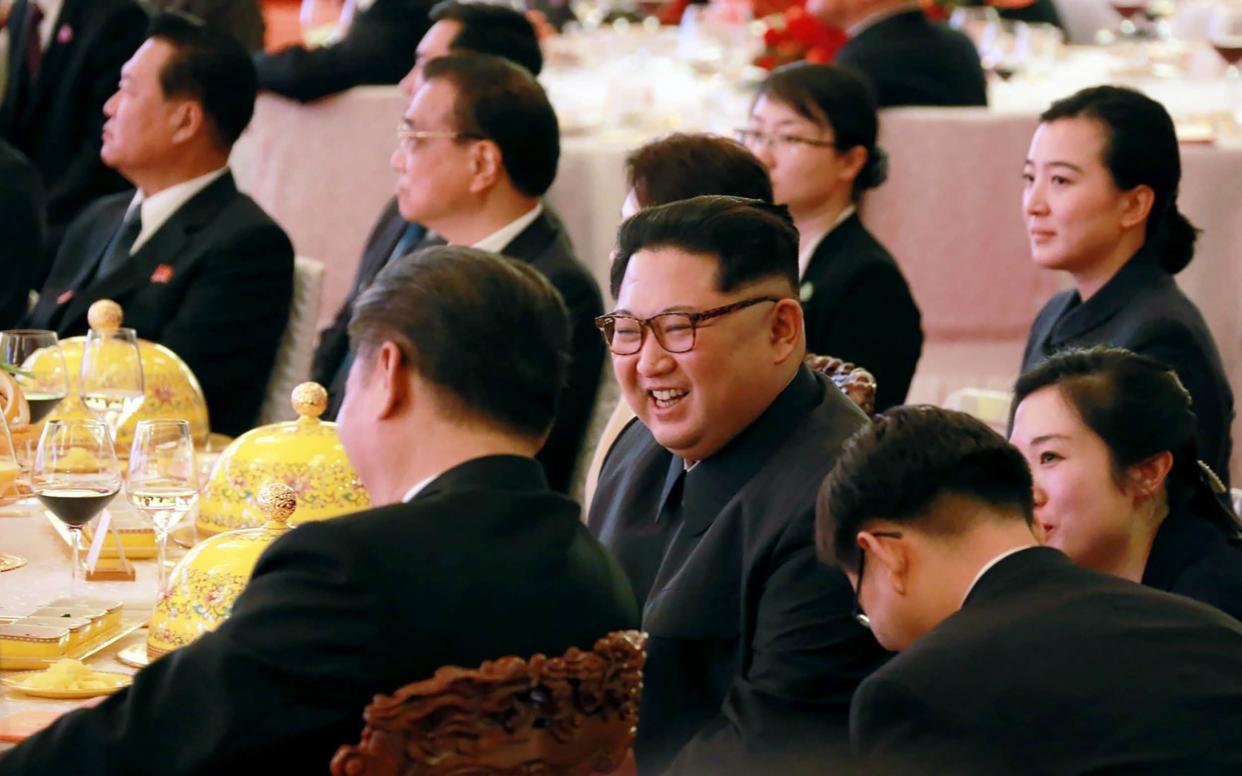 Kim Jong-un during a dinner banquet at the Great Hall of the People in Beijing, March 26 - AFP