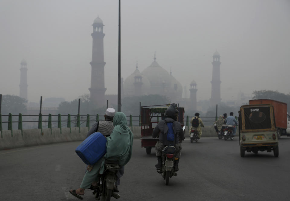 Heavy smog blankets the historical Badshahi Mosque, in Lahore, Pakistan, Thursday, Nov. 21, 2019. Amnesty International issues "Urgent Action" saying every person in Lahore at risk. Heavy smog has enveloped many cities of Punjab province, causing highway accidents and respiratory problems, and forcing many residents to stay home. (AP Photo/K.M. Chaudary)