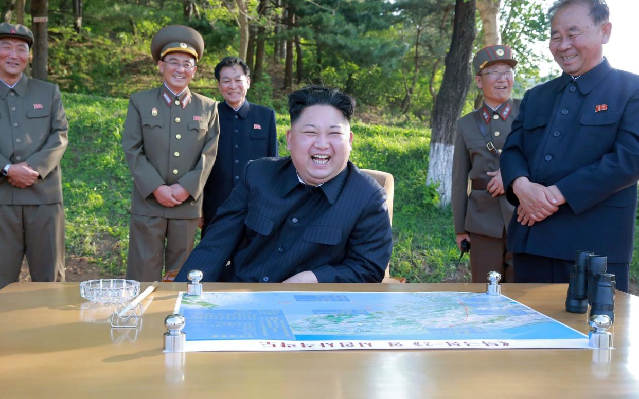 North Korean leader Kim Jong Un inspects the intermediate-range ballistic missile Pukguksong-2's launch test - REUTERS