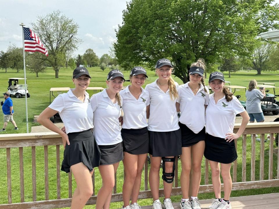 The Woodward-Granger girls golf team poses for a photo after placing first during a regional meet on Friday, May 12, 2023, at Woodward Golf Club.
