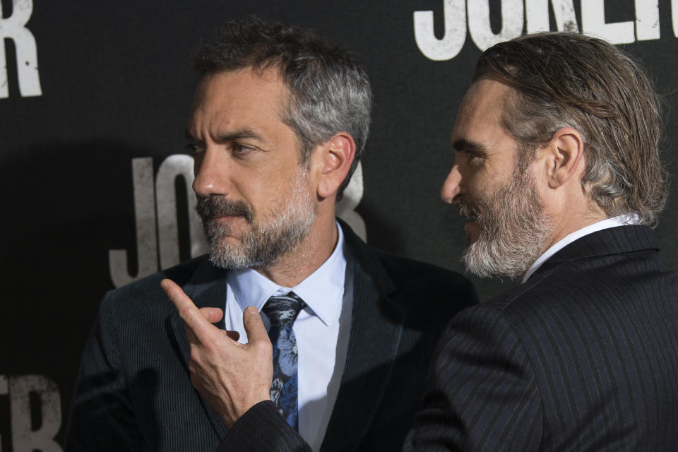 Director Todd Phillips, left and actor Joaquin Phoenix pose for photographers upon arrival at the screening for the film Joker, at a central London cinema, Wednesday, Sept 25, 2019. (Photo by Joel C Ryan/Invision/AP)