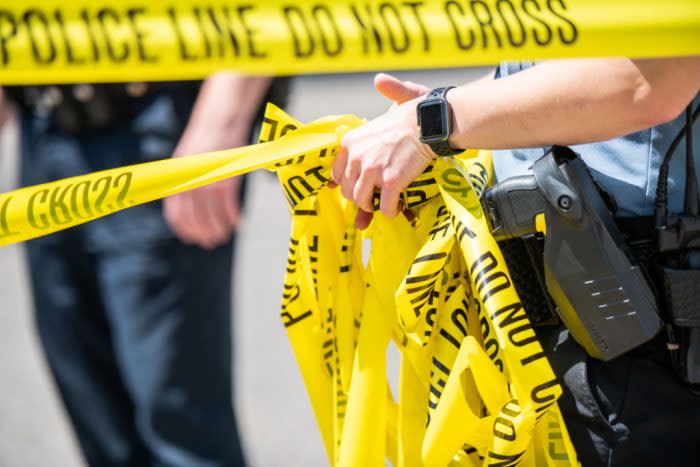 Police in Minneapolis unravel crime scene tape in 2020, a year marked by a stark rise in homicides. Community violence intervention programs offer a data-backed alternative to policing. Brandon Bell/Getty Images