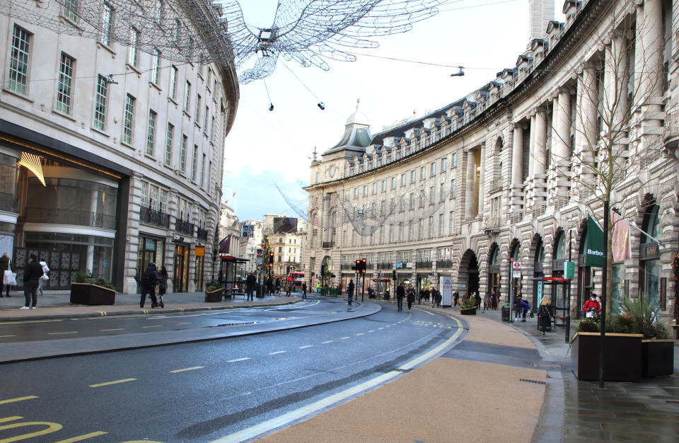 LONDON, UNITED KINGDOM - 2020/12/19: Only a handful of people in Regent Street despite it being closed to traffic. London enters Tier 4 severe restrictions as new Mutant Covid-19 strain is found. The new variant of the virus has been found to be 70% more infectious and is currently rampant throughout London and the South East of England. (Photo by Keith Mayhew/SOPA Images/LightRocket via Getty Images)