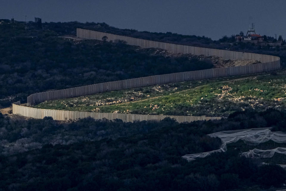 The sun lights part of the border between Israel and Lebanon in northern Israel, Sunday, Feb. 18, 2024. (AP Photo/Ariel Schalit)