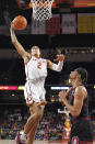 Southern California forward Kobe Johnson, left, shoots as Stanford forward Jaiden Delaire defends during the first half of an NCAA college basketball game Thursday, Jan. 27, 2022, in Los Angeles. (AP Photo/Mark J. Terrill)