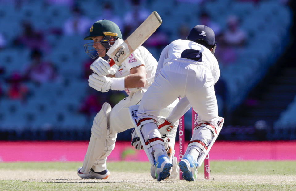 Australia's Marnus Labuschagne plays a sweep shot during play on day three of the third cricket test between India and Australia at the Sydney Cricket Ground, Sydney, Australia, Saturday, Jan. 9, 2021. (AP Photo/Rick Rycroft)