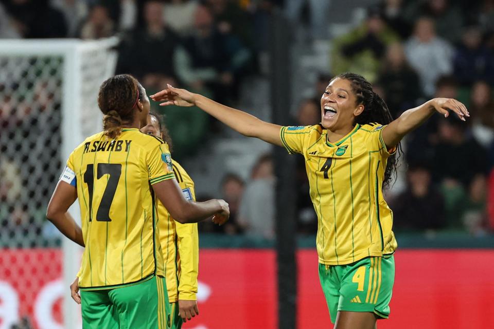 Jamaica defender Allyson Swaby, left, celebrates scoring her team's first goal with teammate, and sister, Chantelle Swaby, also a defender, during a goup match against Panama at the 2023 World Cup.