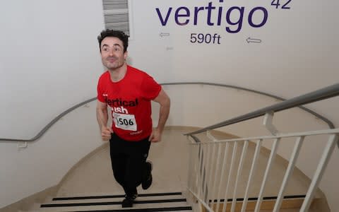 Joe McFadden takes part in the Vertical Rush by racing up the 932 steps to the top of Tower 42 in London, to raise money for Shelter - Credit: PA