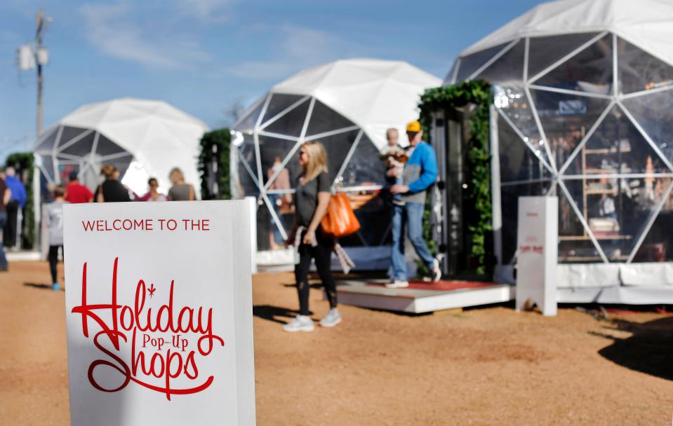 Shoppers browse and purchase gifts during a previous year at Midtown Holiday Pop-Up Shops in Oklahoma City.