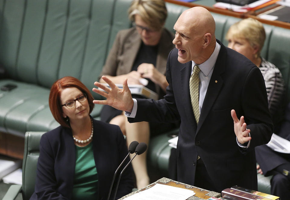 As minister for school education, early childhood, and youth, Peter Garrett speaks during House of Representatives question time in May 2013 in Canberra, Australia. (Photo: Stefan Postles/Getty Images)