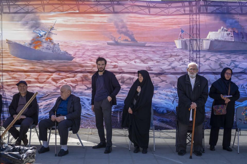 Iranians stand in front of an anti-U.S. and anti-Israeli banner during a rally commemorating International Quds Day, also known as Jerusalem Day, during a funeral for members of the IRGC Quds Force who were killed in an Israeli airstrike in Syria, in Tehran, Iran, April 5, 2024. / Credit: Morteza Nikoubazl/NurPhoto/Getty