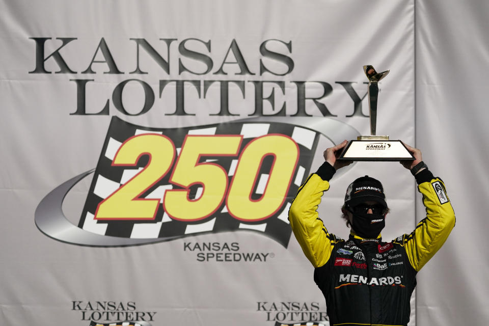 Brandon Jones celebrates after winning a NASCAR Xfinity Series auto race at Kansas Speedway in Kansas City, Kan., Saturday, July 25, 2020. (AP Photo/Charlie Riedel)