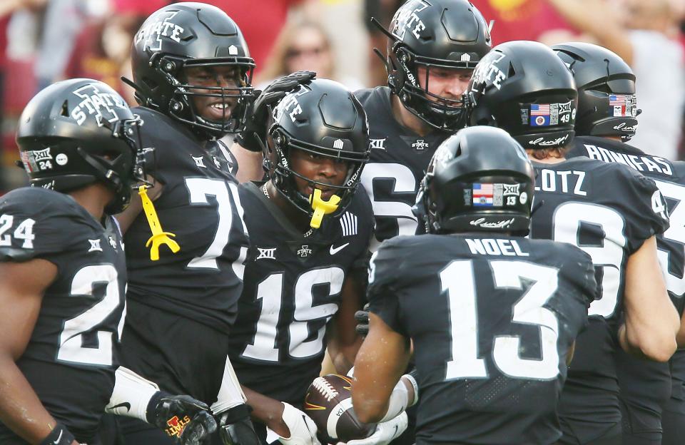 Iowa State wide receiver Daniel Jackson (16) celebrates with his teammates after catching a touchdown pass against Oklahoma State on Saturday in Ames.