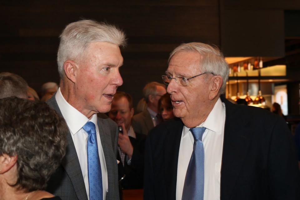 Former Green Bay Packers general managers Ted Thompson, left, and Ron Wolf talk during the Green Bay Packers Hall of Fame Inc. banquet in 2019 at Lambeau Field. Thompson was inducted into the Packers Hall of Fame that year.