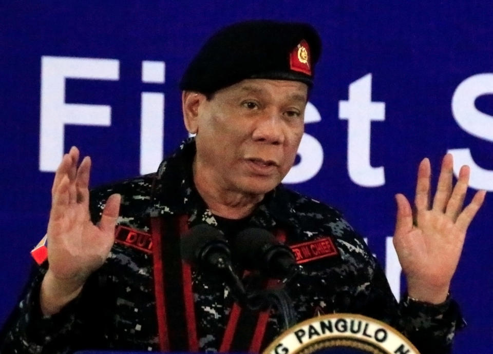 FILE PHOTO: Philippine President Rodrigo Duterte, wearing a military uniform, gestures as he delivers a speech during the 67th founding anniversary of the First Scout Ranger regiment in San Miguel, Bulacan, Philippines November 24, 2017. REUTERS/Romeo Ranoco