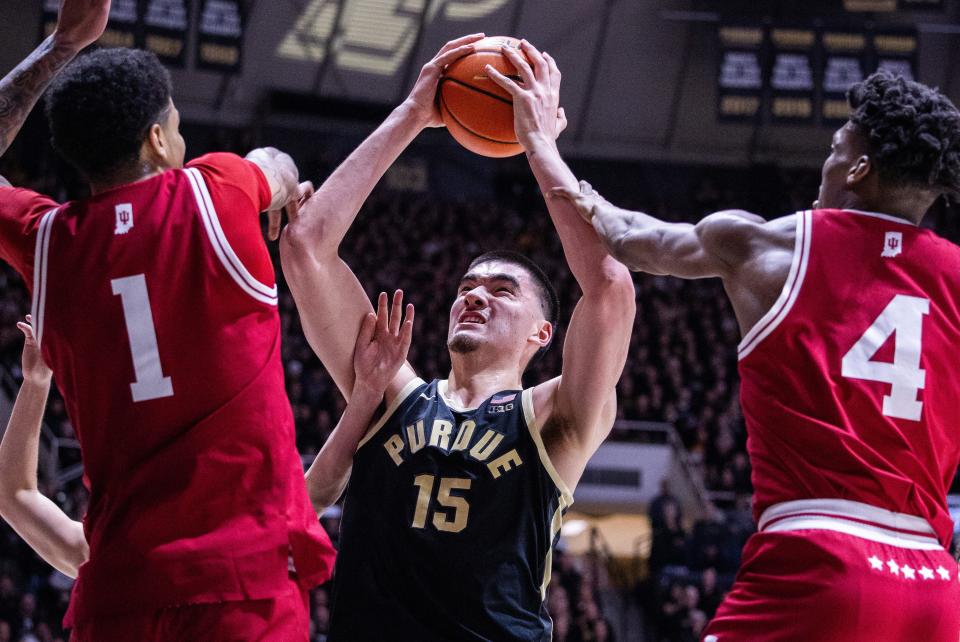Feb 10, 2024; West Lafayette, Indiana, USA; Purdue Boilermakers center Zach Edey (15) shoots the ball while Indiana Hoosiers center Kel'el Ware (1) and forward Anthony Walker (4) defend in the second half at Mackey Arena. Mandatory Credit: Trevor Ruszkowski-USA TODAY Sports