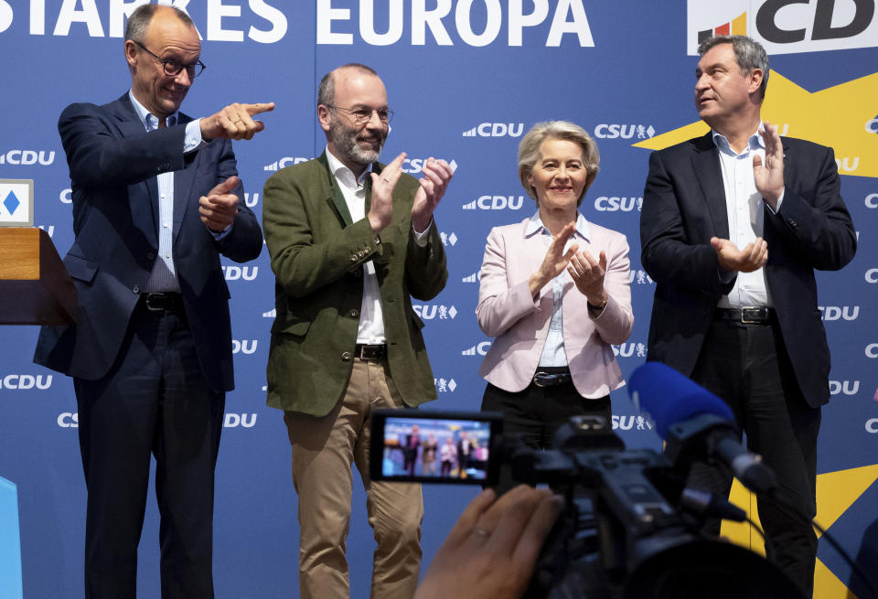 From left, Federal Chairman of the CDU Friedrich Merz, CSU lead candidate for the European elections Manfred Weber, President of the European Commission and EU and EPP lead candidate Ursula von der Leyen, and Chairman of the CSU and Minister President of Bavaria Markus Soeder take part in the CDU and CSU closing rally for the European elections in the Lowenbraukeller, in Munich, Germany, Friday June 7, 2024. (Sven Hoppe/dpa via AP)