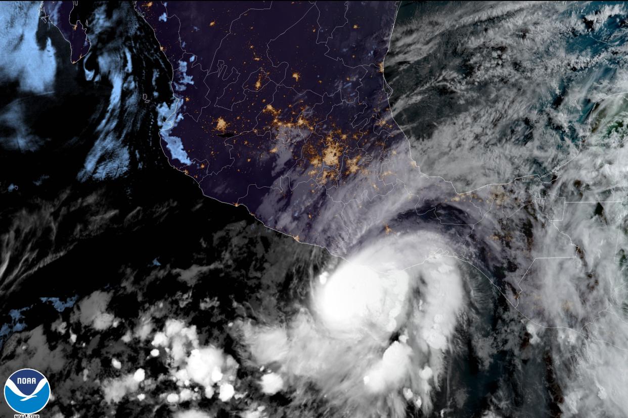 This satellite image made available by NOAA shows Hurricane Agatha off the Pacific coast of Oaxaca state, Mexico.