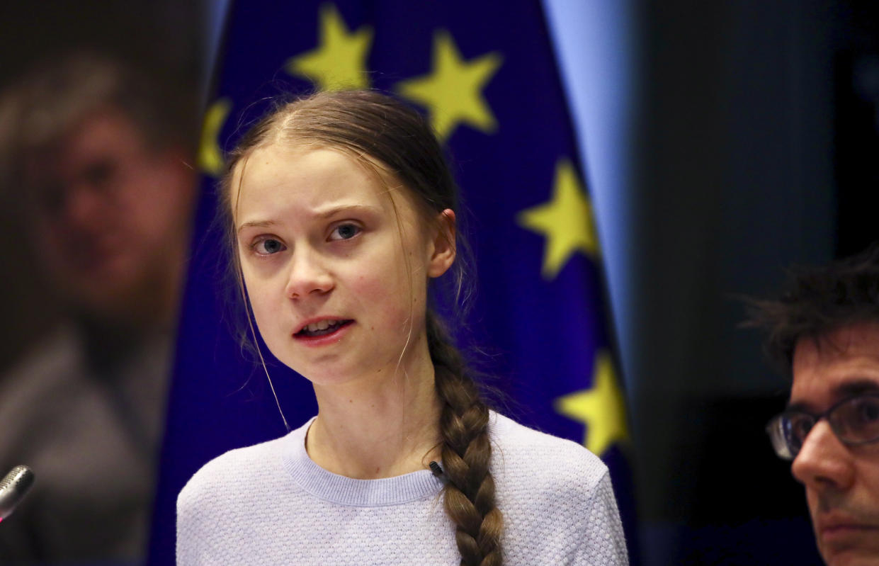 Swedish climate activist Greta Thunberg addresses a meeting of the Environment Council at the European Parliament in Brussels, Wednesday, March 4, 2020. Climate activists and Green members of the European Parliament are urging the European Union to be more ambitious as the bloc gets ready to unveil plans for a climate law to cut greenhouse gas emissions to zero by mid-century. (AP Photo/Olivier Matthys)