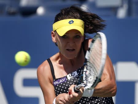 Agnieszka Radwanska of Poland hits a return to Peng Shuai of China during their match at the 2014 U.S. Open tennis tournament in New York, August 27, 2014. REUTERS/Mike Segar