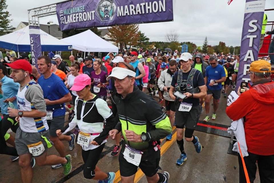 Runners leave the starting line of the 2018 Lakefront Marathon near Grafton High School on their way to a finish at Veterans Park on the Milwaukee lakefront.