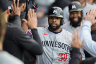 Minnesota Twins' Carlos Santana (30) celebrates after his two-run home run during the second inning of a baseball game against the Chicago White Sox, Monday, April 29, 2024, in Chicago. (AP Photo/Erin Hooley)