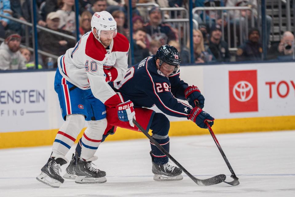 Nov 29, 2023; Columbus, Ohio, USA;
Columbus Blue Jackets right wing Patrik Laine (29) fights for the puck against Montreal Canadiens ring wing Joel Armia during the third period of their game on Wednesday, Nov. 29, 2023 at Nationwide Arena.
